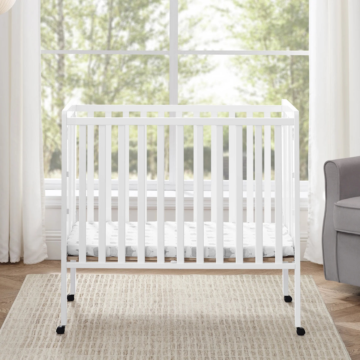 Delta Children Lee Portable Folding Mini Crib with 1.5-Inch Mattress - Greenguard Gold Certified, Bianca White