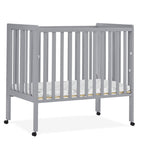 Delta Children Lee Portable Folding Mini Crib with 1.5-Inch Mattress - Greenguard Gold Certified, Bianca White