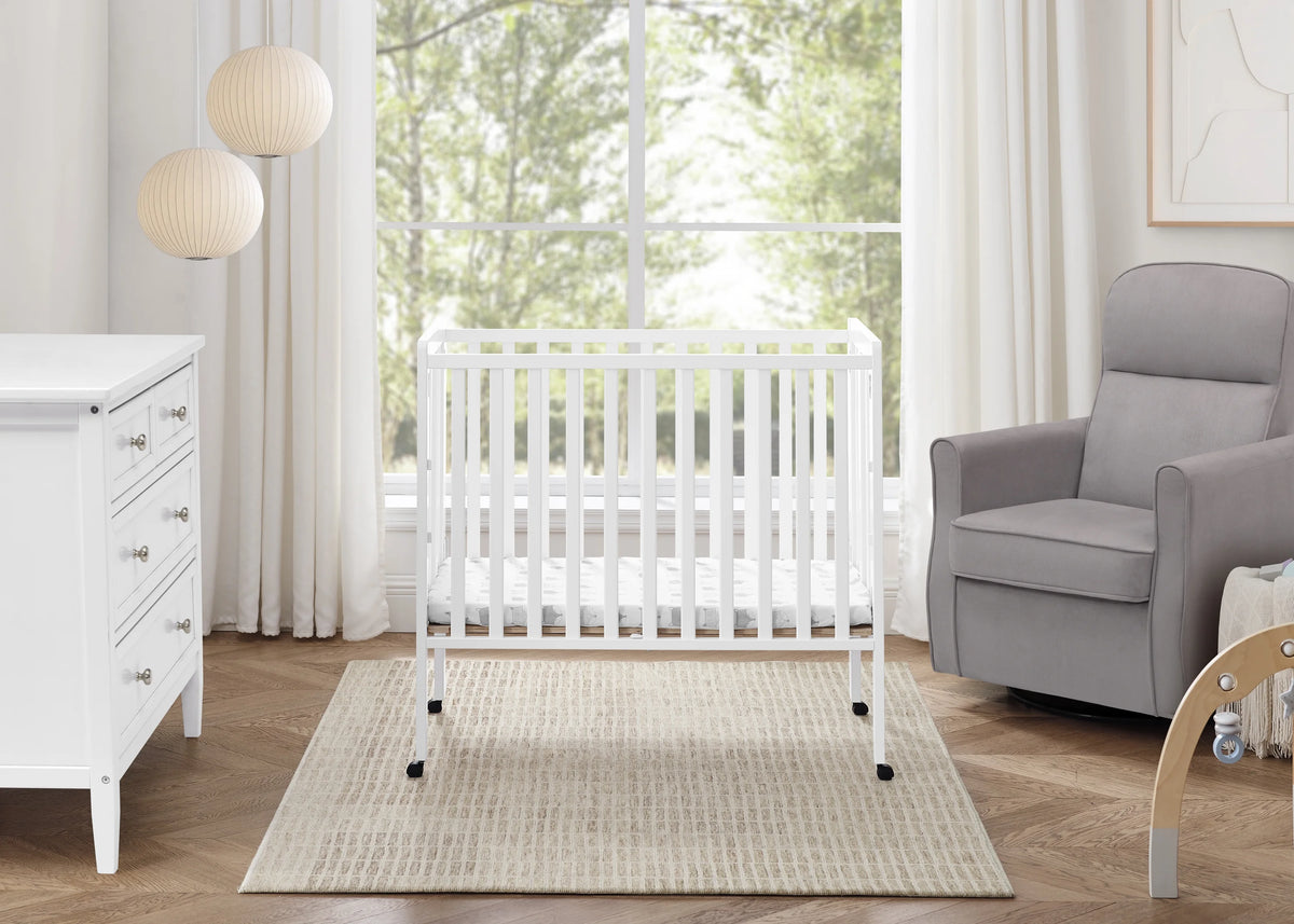 Delta Children Lee Portable Folding Mini Crib with 1.5-Inch Mattress - Greenguard Gold Certified, Bianca White