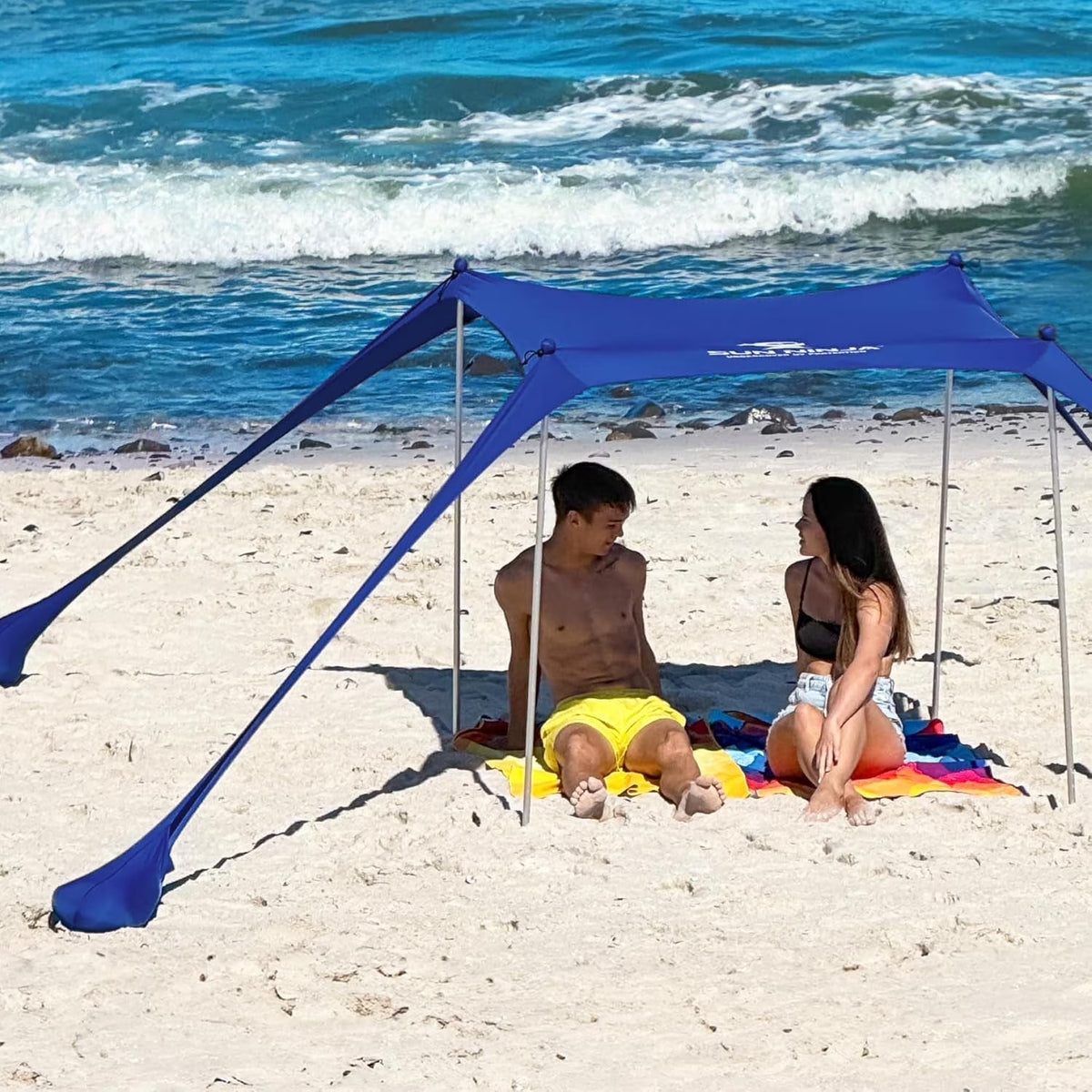 SUN NINJA 10x10.5 FT Pop-Up Beach Tent with Sand Shovel, Pegs & Stability Poles �C Navy Blue Sun Shelter for Beach, Camping & Outdoor Activities